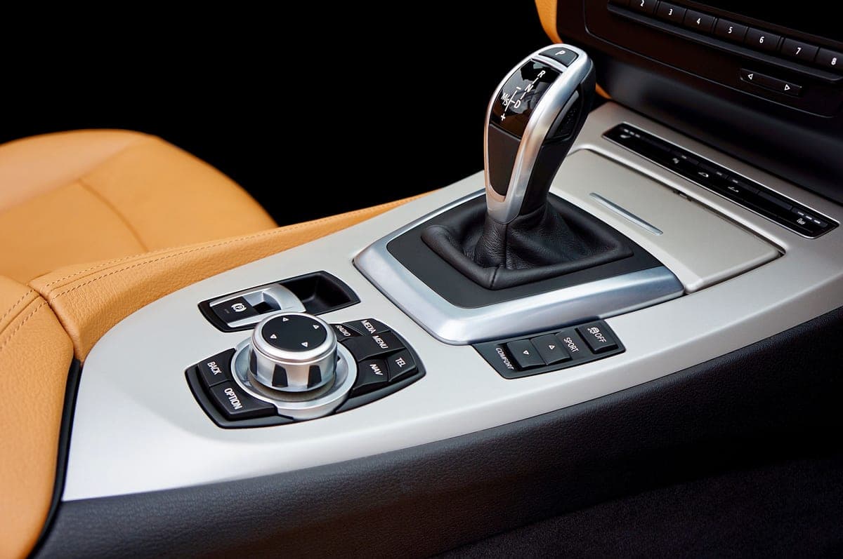 The center console and gear shift of a car interior